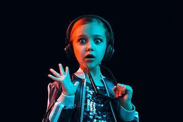 Image showing Young girl with headphones enjoying music