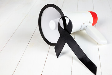 Image showing Black ribbon-symbol of fight against melanoma and skin cancer.
