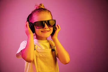 Image showing Young girl with headphones enjoying music