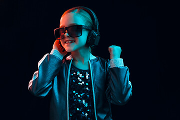 Image showing Young girl with headphones enjoying music