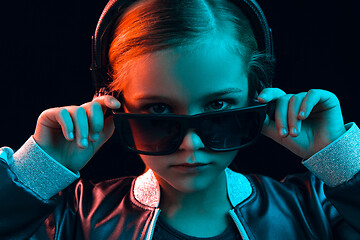 Image showing Young girl with headphones enjoying music