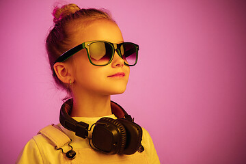 Image showing Young girl with headphones enjoying music