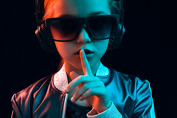 Image showing Young girl with headphones enjoying music