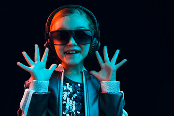 Image showing Young girl with headphones enjoying music