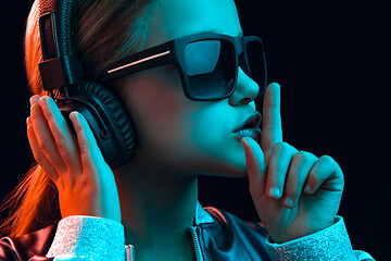 Image showing Young girl with headphones enjoying music