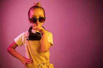 Image showing Young girl with headphones enjoying music