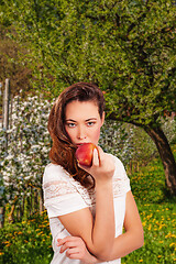 Image showing Young woman with apple