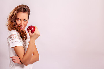 Image showing Woman with a red apple in her hand 