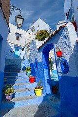 Image showing Blue street with color pots in Chefchaouen