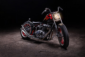 Image showing Custom bobber motorbike in an workshop garage.