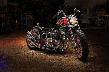 Image showing Custom bobber motorbike in an workshop garage.