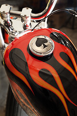 Image showing Custom bobber motorbike in an workshop garage.