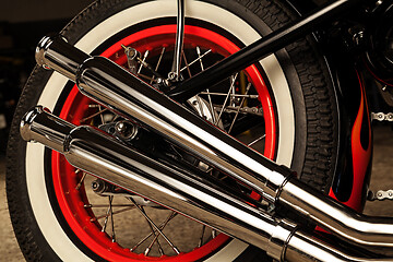 Image showing Custom bobber motorbike in an workshop garage.