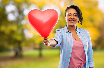 Image showing african american woman with heart-shaped balloon