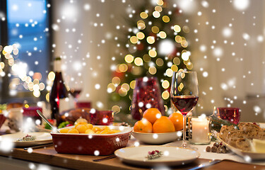 Image showing food and drinks on christmas table at home