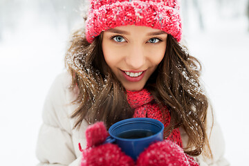 Image showing happy young woman with tea cup in winter