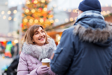 Image showing senior couple with coffee at christmas market