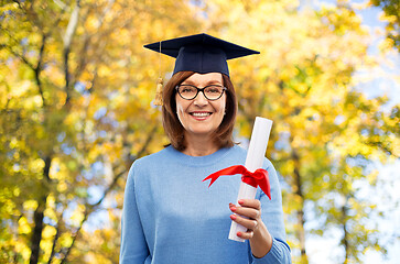 Image showing happy senior graduate student woman with diploma