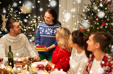 Image showing happy friends having christmas dinner at home