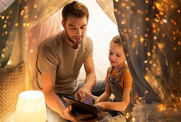 Image showing family with tablet pc in kids tent at home