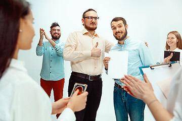 Image showing Boss approving and congratulating young successful employee