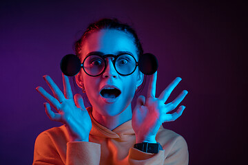 Image showing Surprised woman in glasses looking at camera