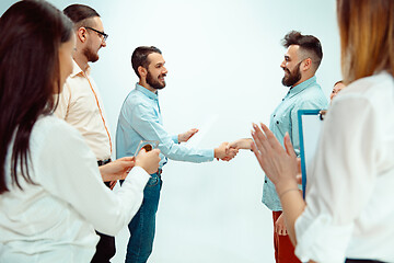 Image showing Boss approving and congratulating young successful employee