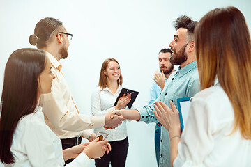 Image showing Boss approving and congratulating young successful employee