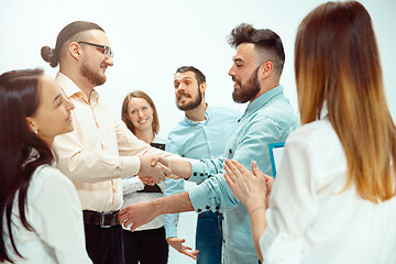 Image showing Boss approving and congratulating young successful employee