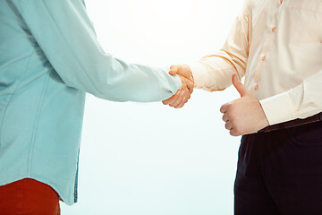 Image showing Boss approving and congratulating young successful employee