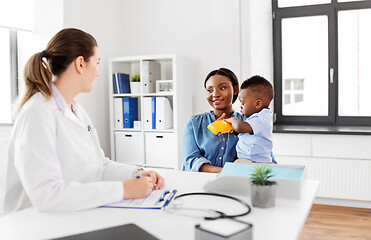 Image showing happy mother with baby son and doctor at clinic