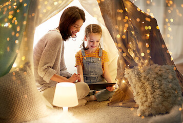 Image showing family with tablet pc in kids tent at home