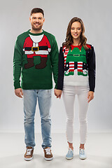 Image showing happy couple at christmas ugly sweater party