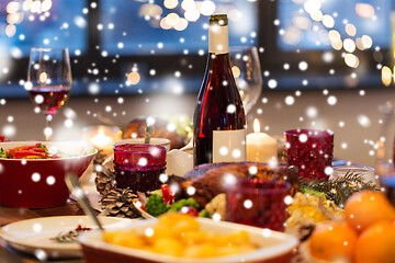 Image showing food and drinks on christmas table at home