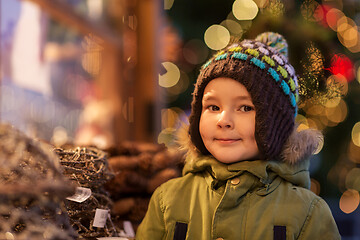 Image showing happy little boy at christmas market in winter