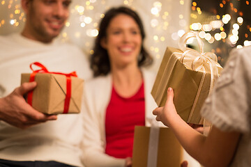 Image showing close up of family with christmas gifts at home