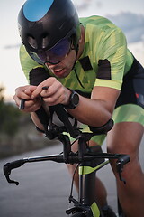 Image showing triathlon athlete riding a bike