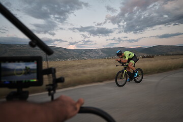 Image showing triathlon athlete riding a bike