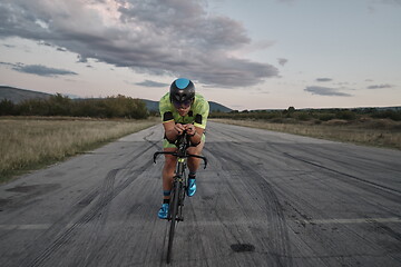 Image showing triathlon athlete riding a bike