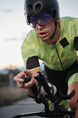 Image showing triathlon athlete riding a bike