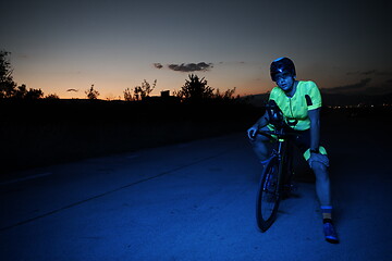 Image showing triathlon athlete portrait while resting on bike training