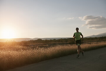 Image showing triathlon athlete running on morning trainig