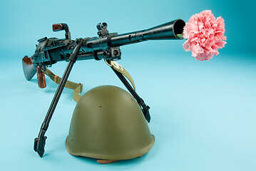 Image showing Machine Gun And Flowers