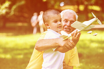 Image showing grandfather and child have fun  in park