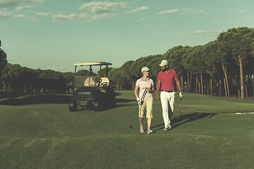 Image showing couple walking on golf course