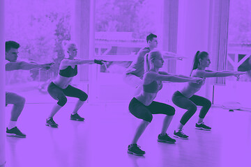 Image showing Group of people exercising at the gym