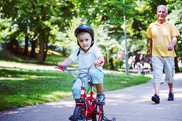 Image showing grandfather and child have fun  in park