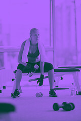 Image showing young woman exercise with dumbells