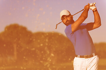 Image showing pro golfer hitting a sand bunker shot