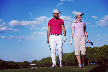 Image showing couple walking on golf course